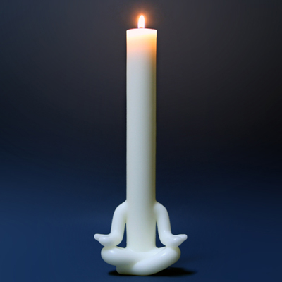 Candle man meditates